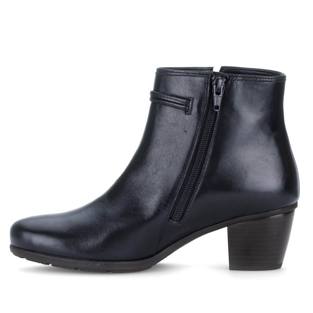 A Gabor Navy leather ankle boot with a low block heel, a side zipper, and a decorative strap detail with silver hardware on the side collar, shown against a plain white background.