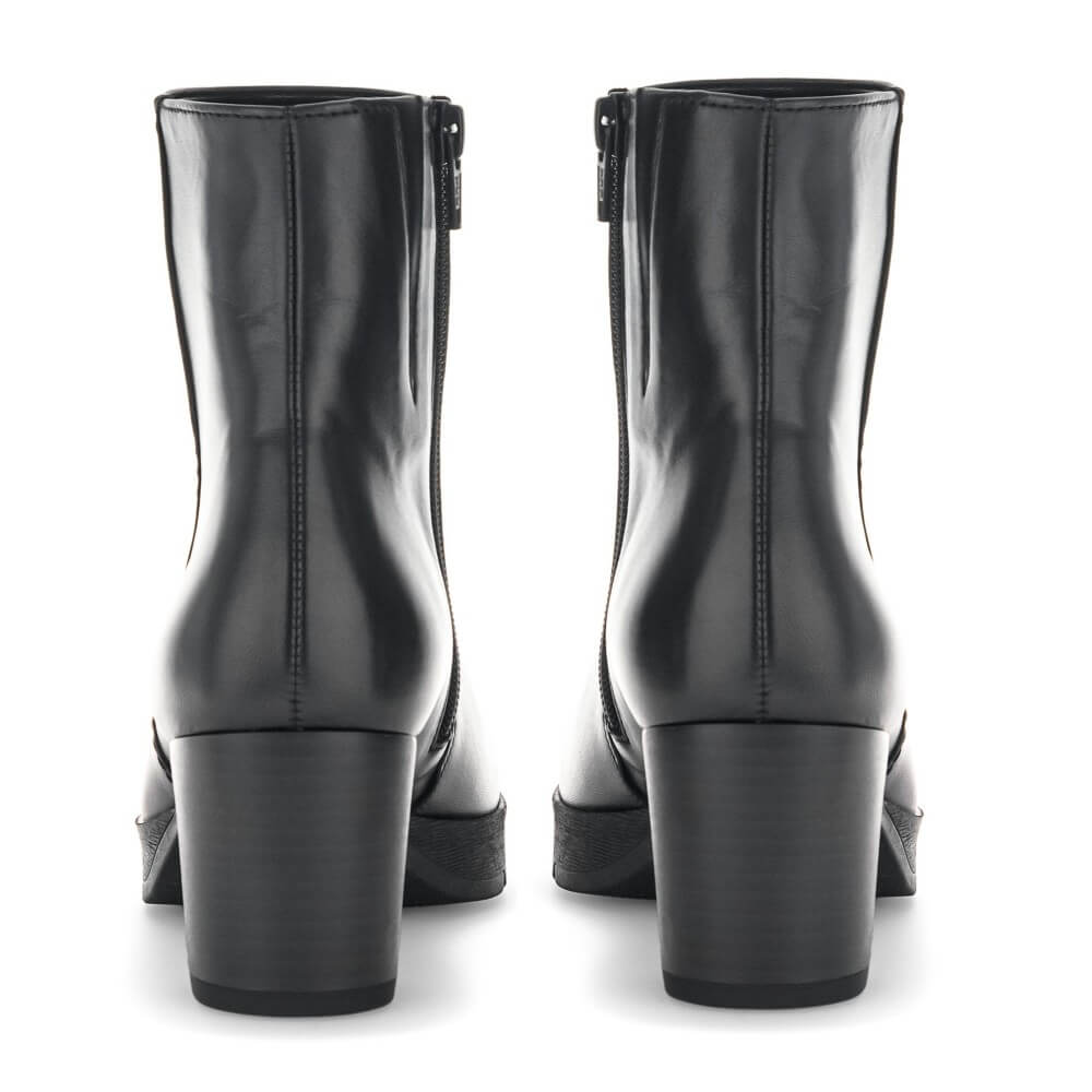 A pair of black leather ankle boots with a block heel, shown from the back on a white background.