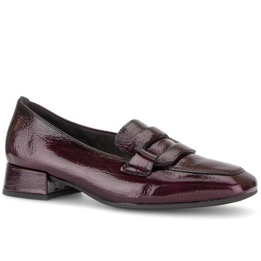 Gabor patent leather loafer in a deep burgundy colour, featuring a low block heel and a decorative strap detail across the vamp, shown against a plain white background.