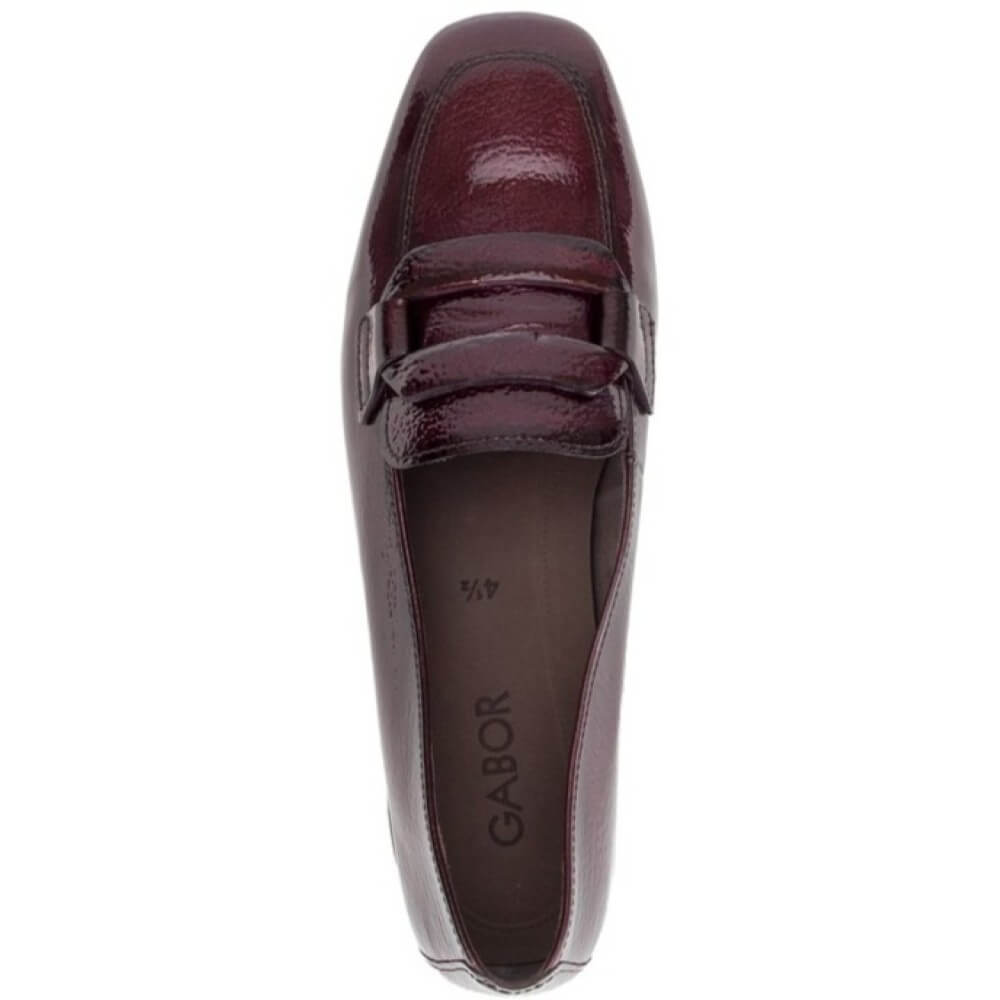 Gabor patent leather loafer in a deep burgundy colour, featuring a low block heel and a decorative strap detail across the vamp, shown against a plain white background.