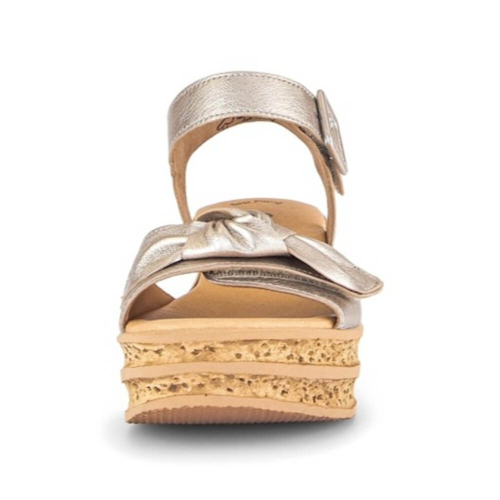 Gabor Gold wedge sandals with a bow on a white background