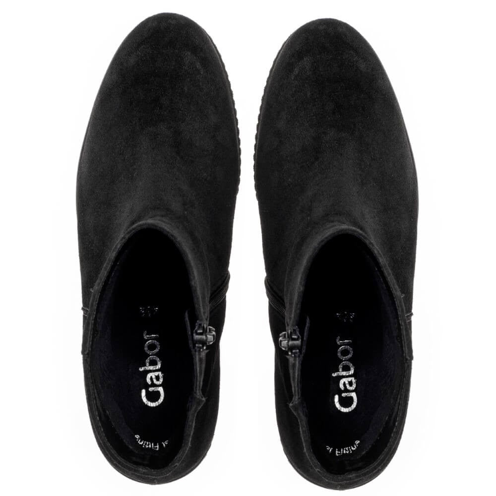 A pair of Gabor black suede ankle boots shown from a top-down view on a plain white background. The brand name 'Gabor' is printed in white on the black insoles.