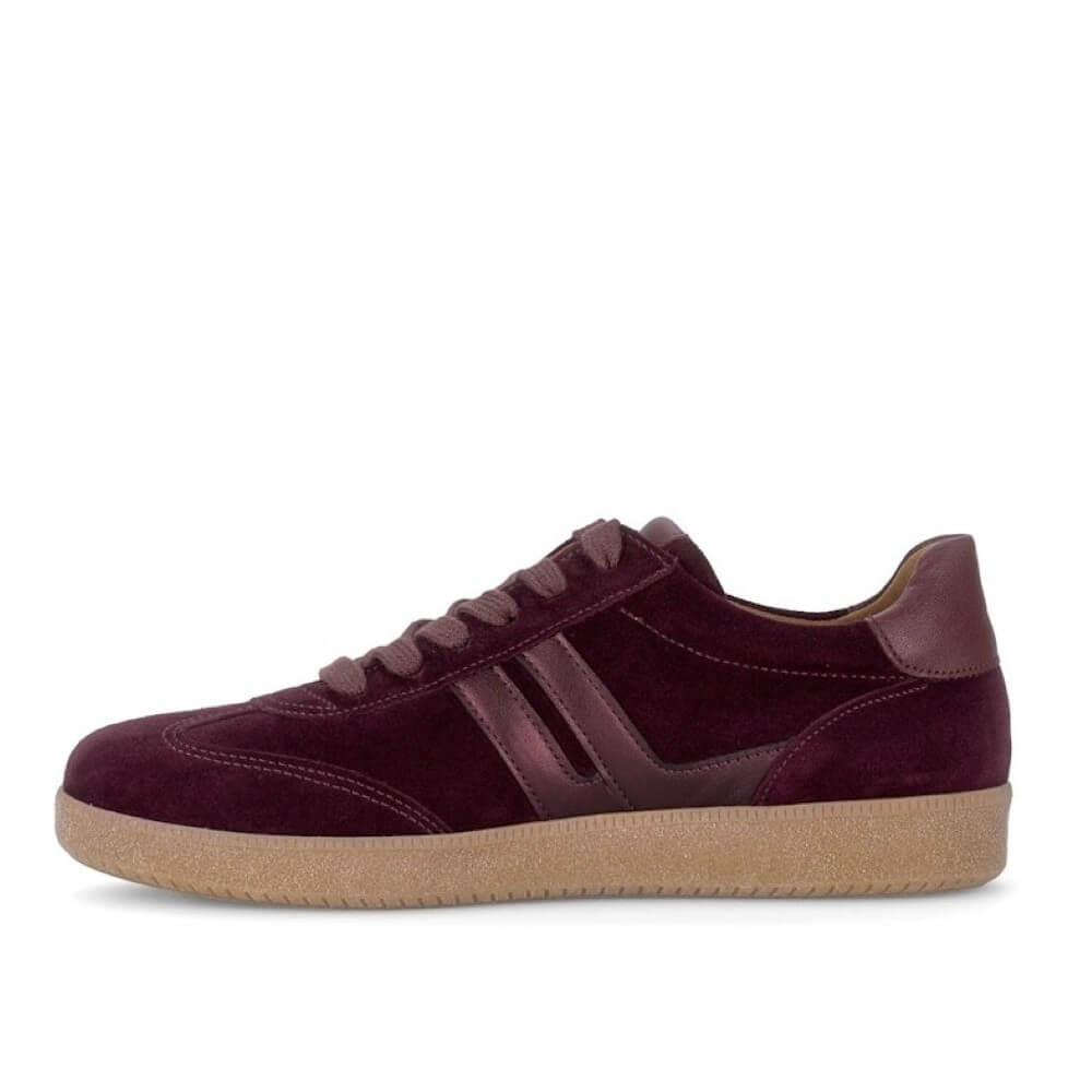 Gabor low-top suede sneaker in deep burgundy with matching laces and side stripes, featuring a light tan rubber sole, shown in a side profile on a white background.