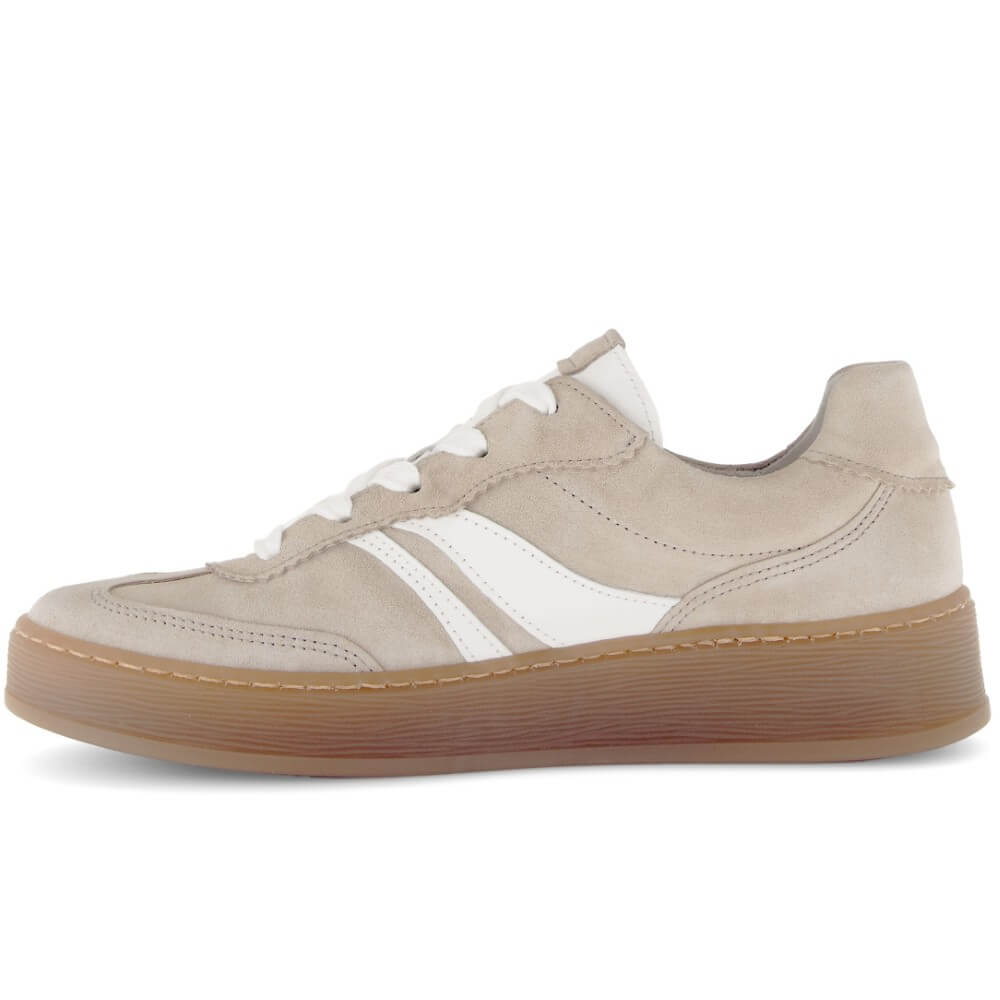 Beige sneaker with white stripes on a white background