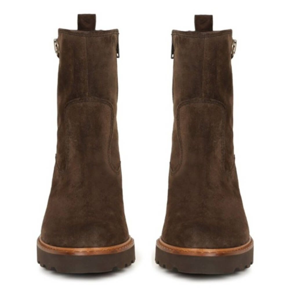 Pair of brown suede boots on a white background