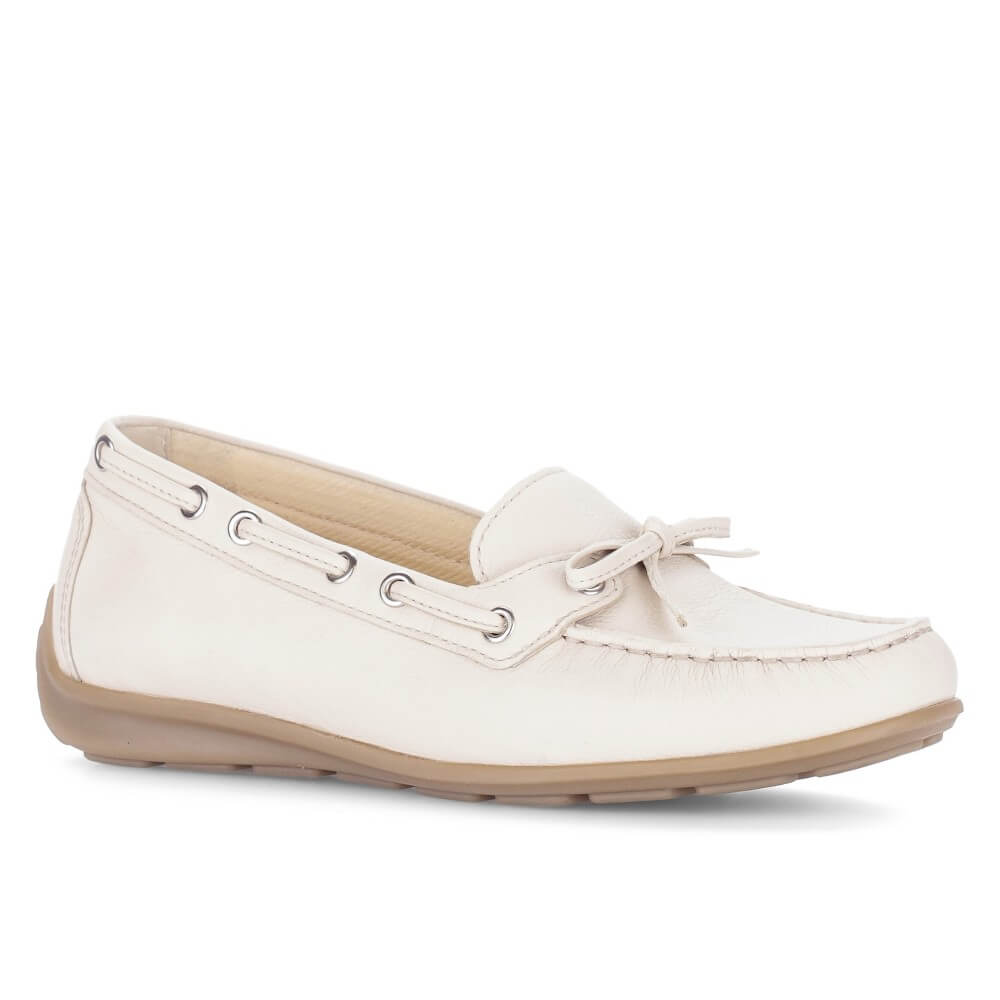 White boat shoe with brown sole on a white background