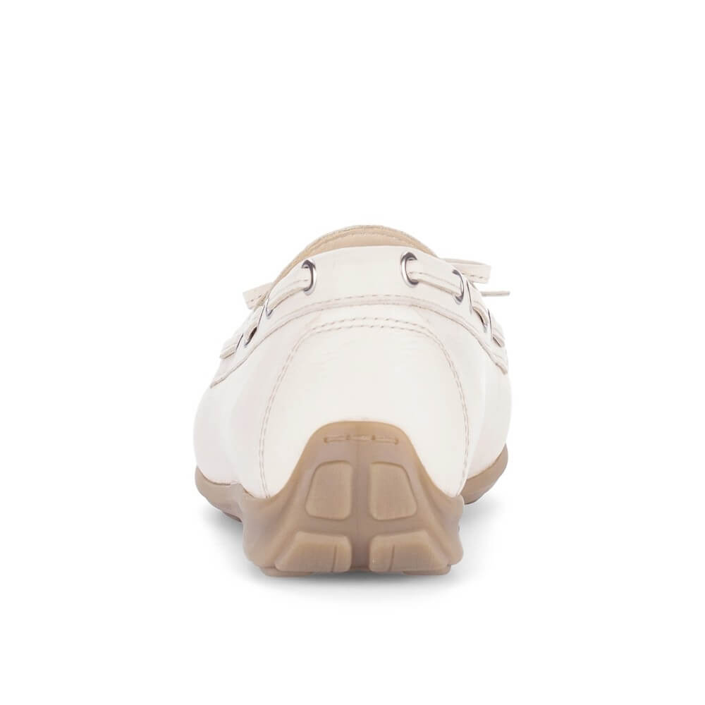White shoe with a brown sole on a white background
