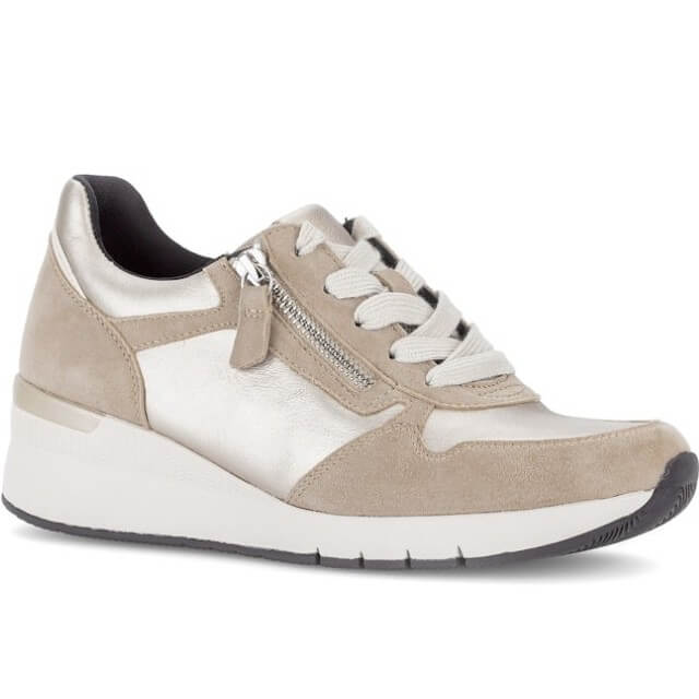 Beige and gold sneaker with a visible brand logo on a white background