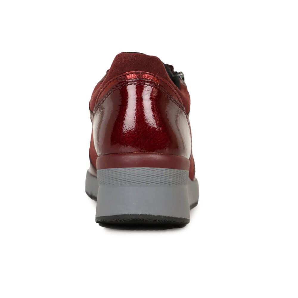 Red shoe with a gray sole on a white background