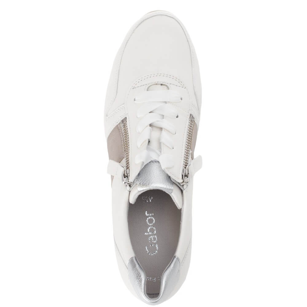 White sneaker with silver zippers on a white background
