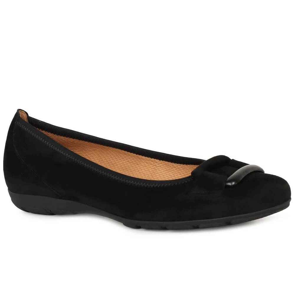 Black flat shoe with a detail on a white background