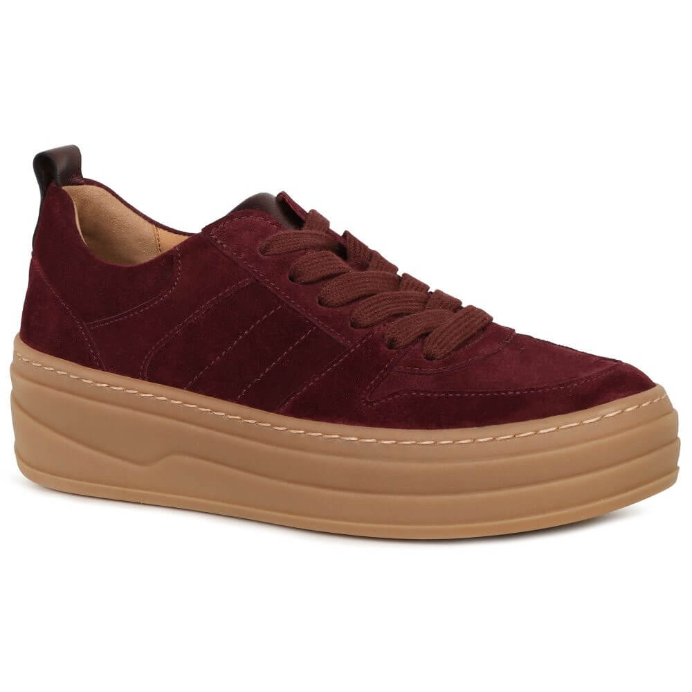 Maroon sneaker with a brown sole on a white background
