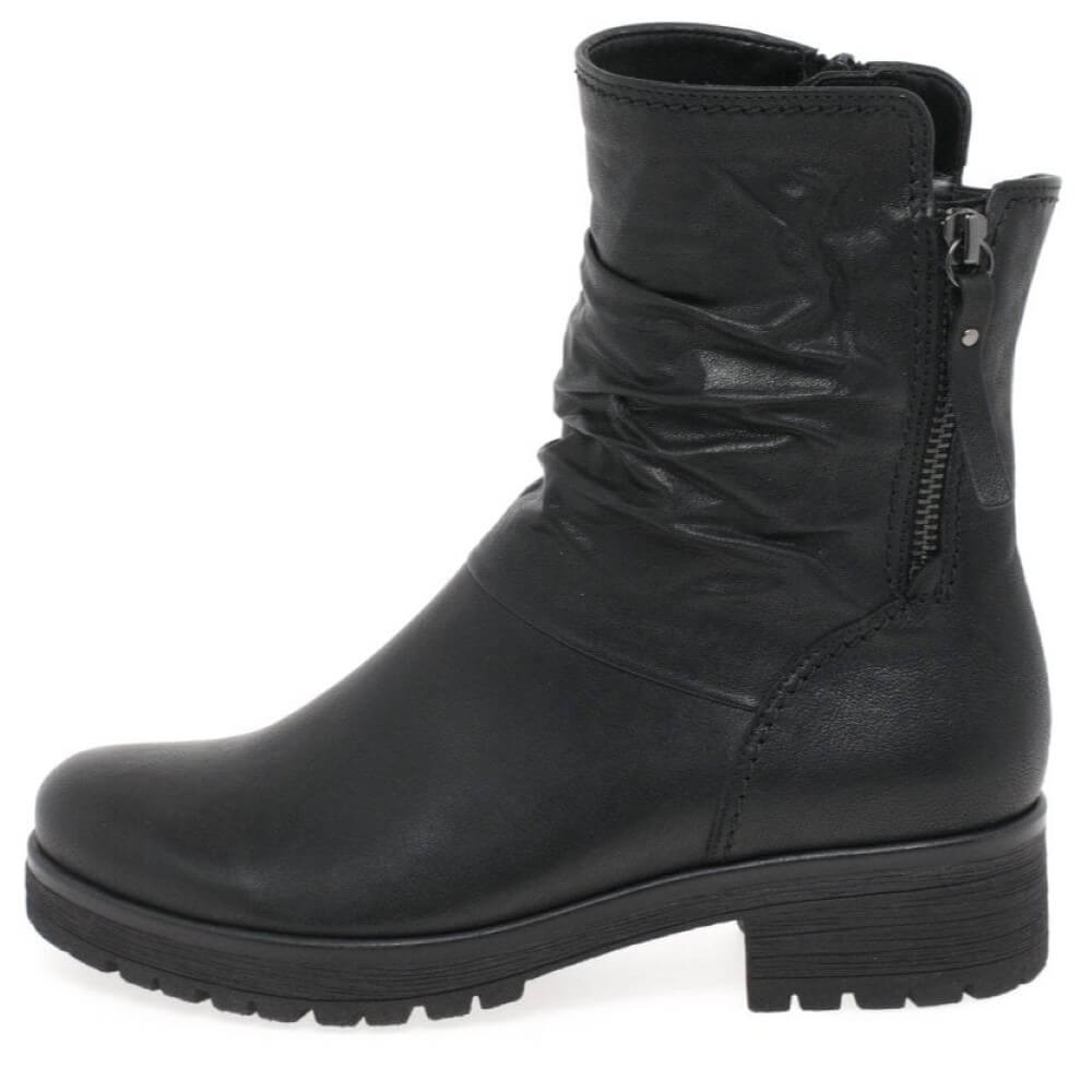 Black leather boot with a zipper on a white background