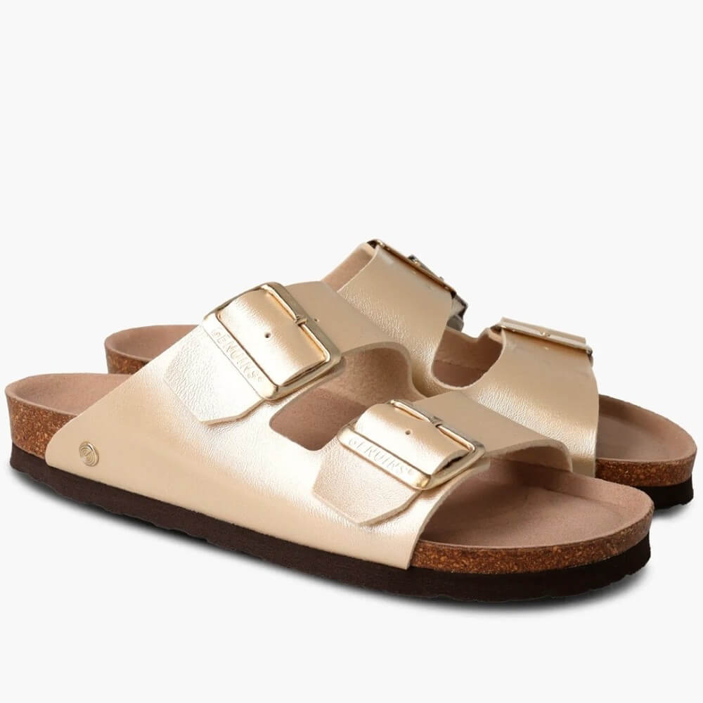 Genuins gold sandals with gold buckles on a white background