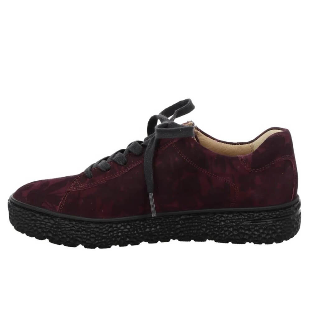 A Hartjes low-top sneaker in a deep burgundy and black floral patterned suede, featuring a side zipper, black laces, and a chunky black textured sole.