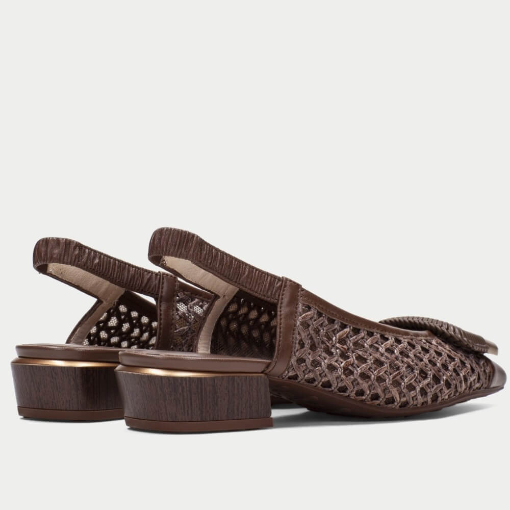 Pair of Hispanitas brown slingback shoes with gold accents on a white background