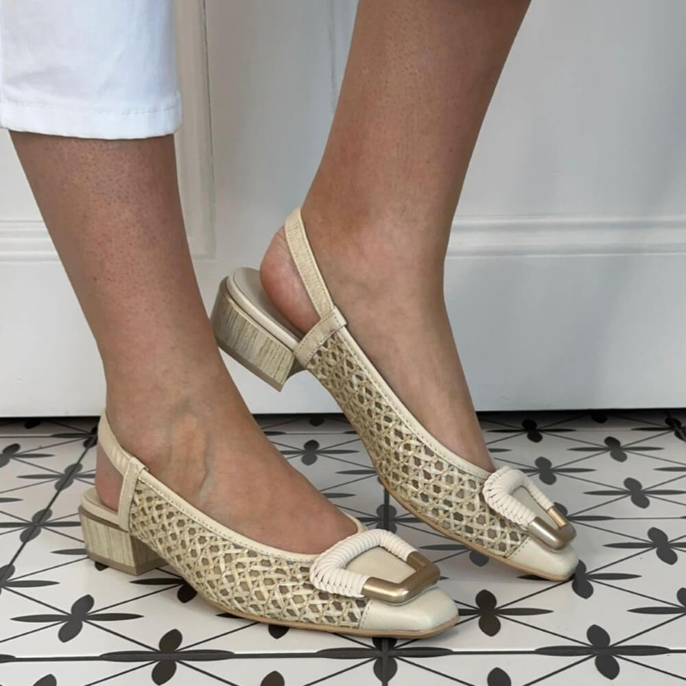 Hipanitas Beige mesh sandals worn by a person on a tiled floor.