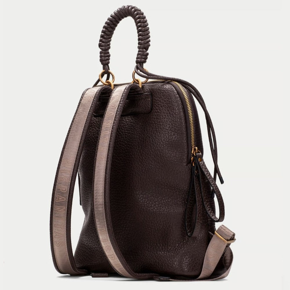 A Hispanitas dark brown textured backpack with a braided top handle, gold-tone zippers, and grey side accents, shown against a light grey background.