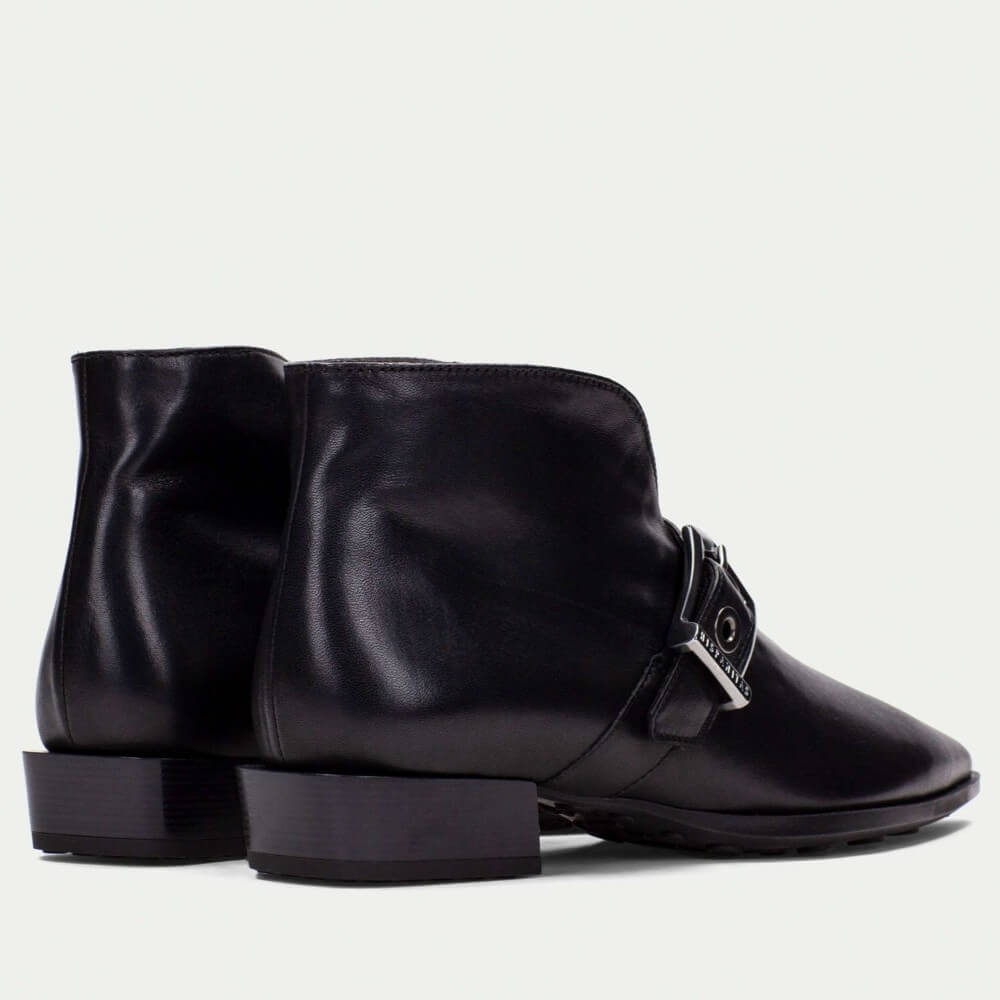Black leather boot with a buckle on a light gray background Hispanitas Turin Leather Ankle Boot HI254360