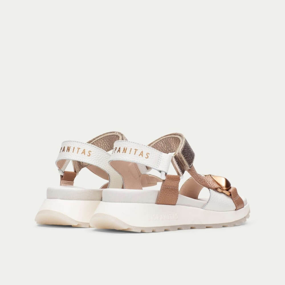 White and brown sandals with 'hispanitas' branding on a white background