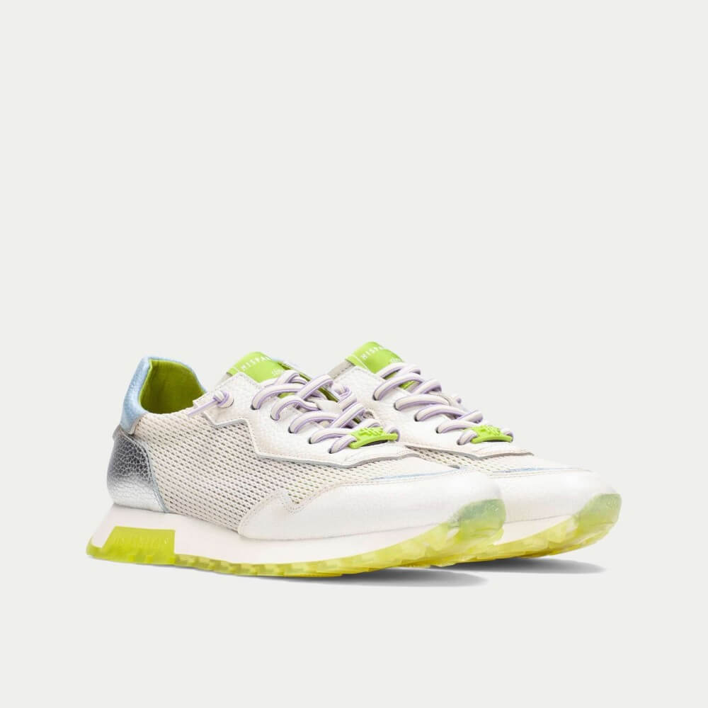 White sneaker with green accents on a white background