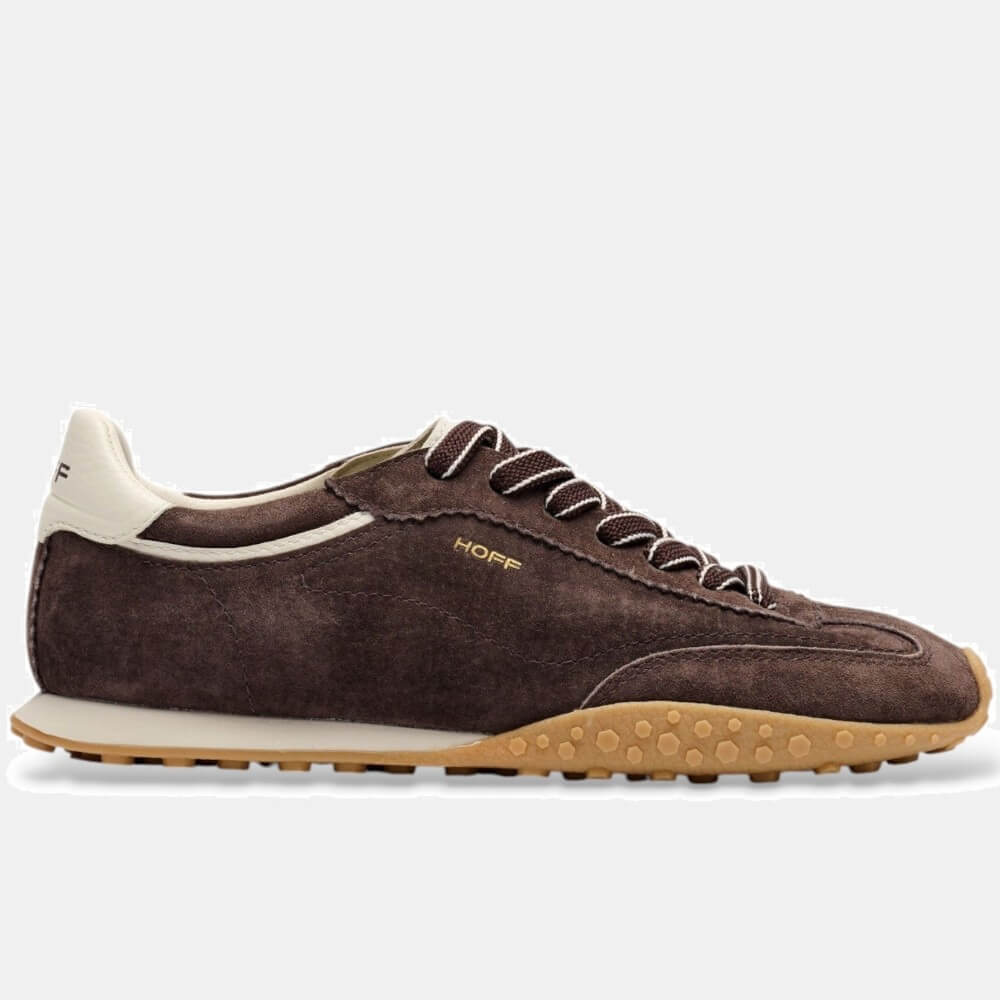 A Hoff brown suede sneaker with a cream collar, white laces, a gold 'HOFF' logo on the side, and a tan textured outsole, shown against a light grey background.