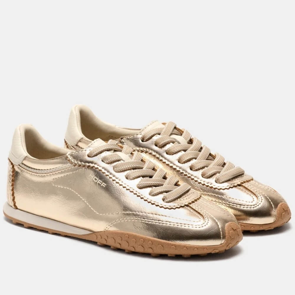 A pair of Hoff metallic gold low-top sneakers with matching gold laces, beige lining, and gum soles, shown on a light grey background.