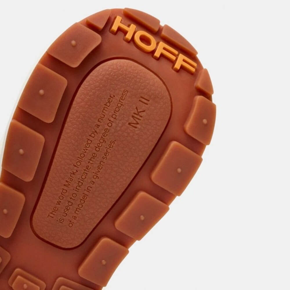 Close-up of a brown shoe sole with 'HOFF' branding on a white background