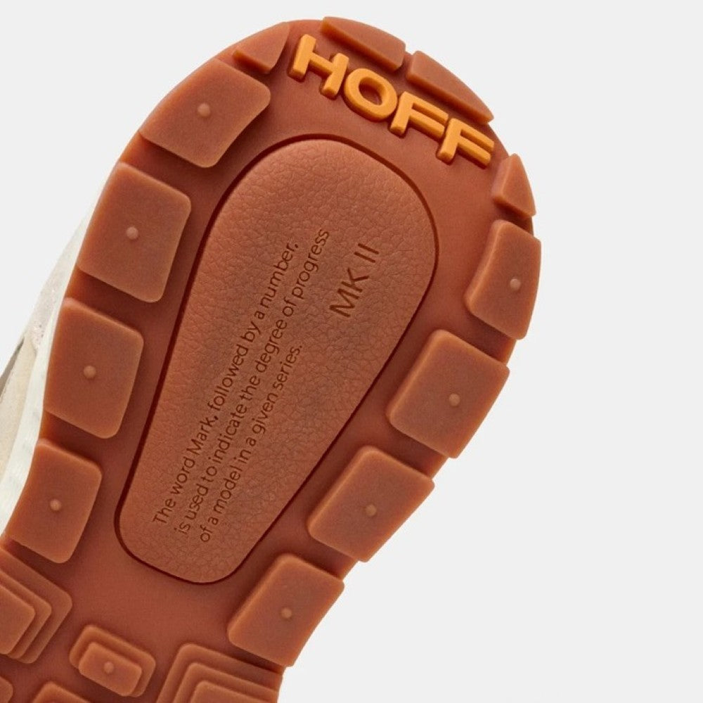 Close-up of a shoe sole with 'HOFF' branding on a white background