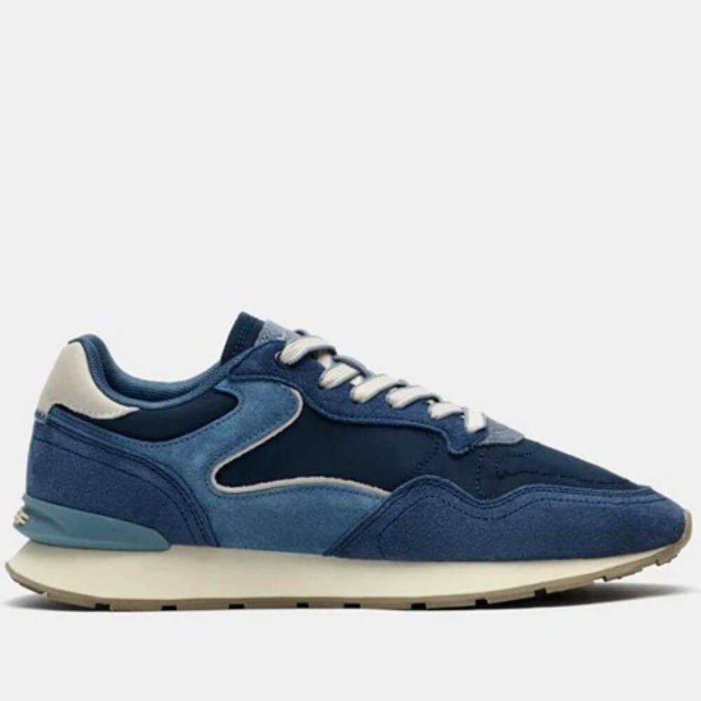 Navy and blue suede sneaker on a light coloured sole