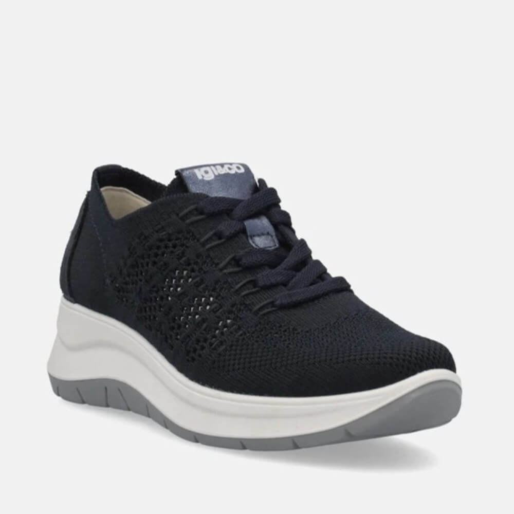 Navy sneaker with a white sole on a light gray background