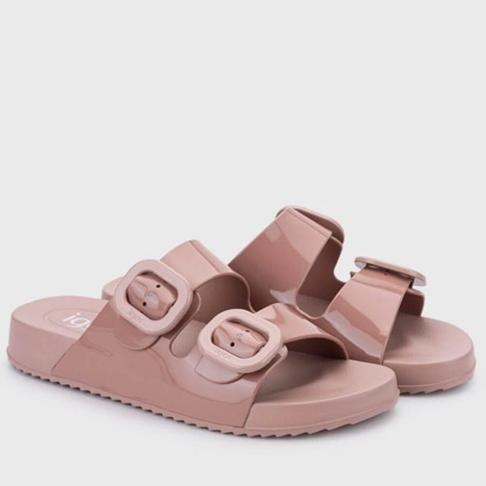 Pair of Igor pink sandals with buckle straps on a light Gray background