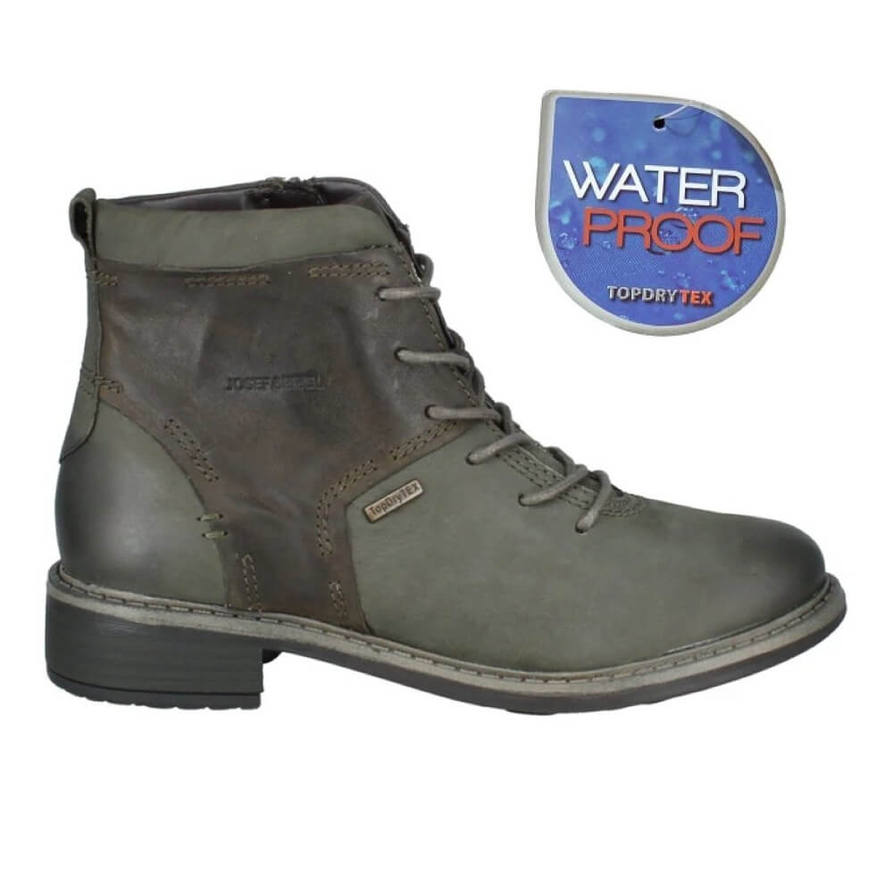 Green leather boot with waterproof label on a white background