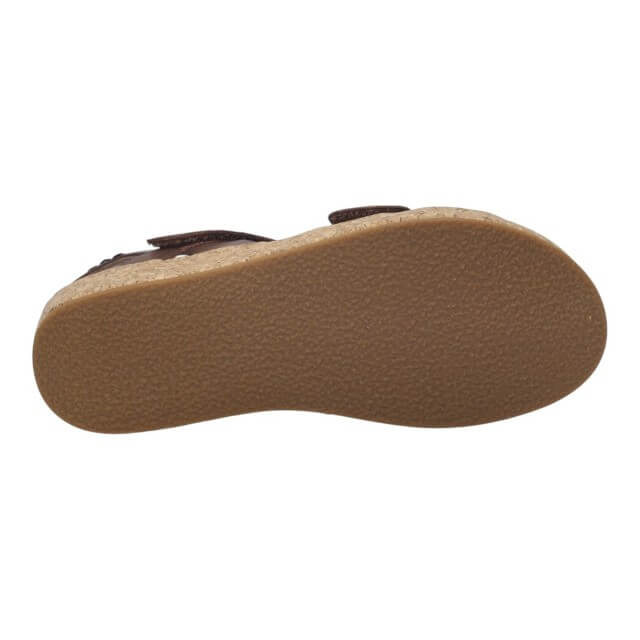 Brown shoe sole with wavy pattern on a white background