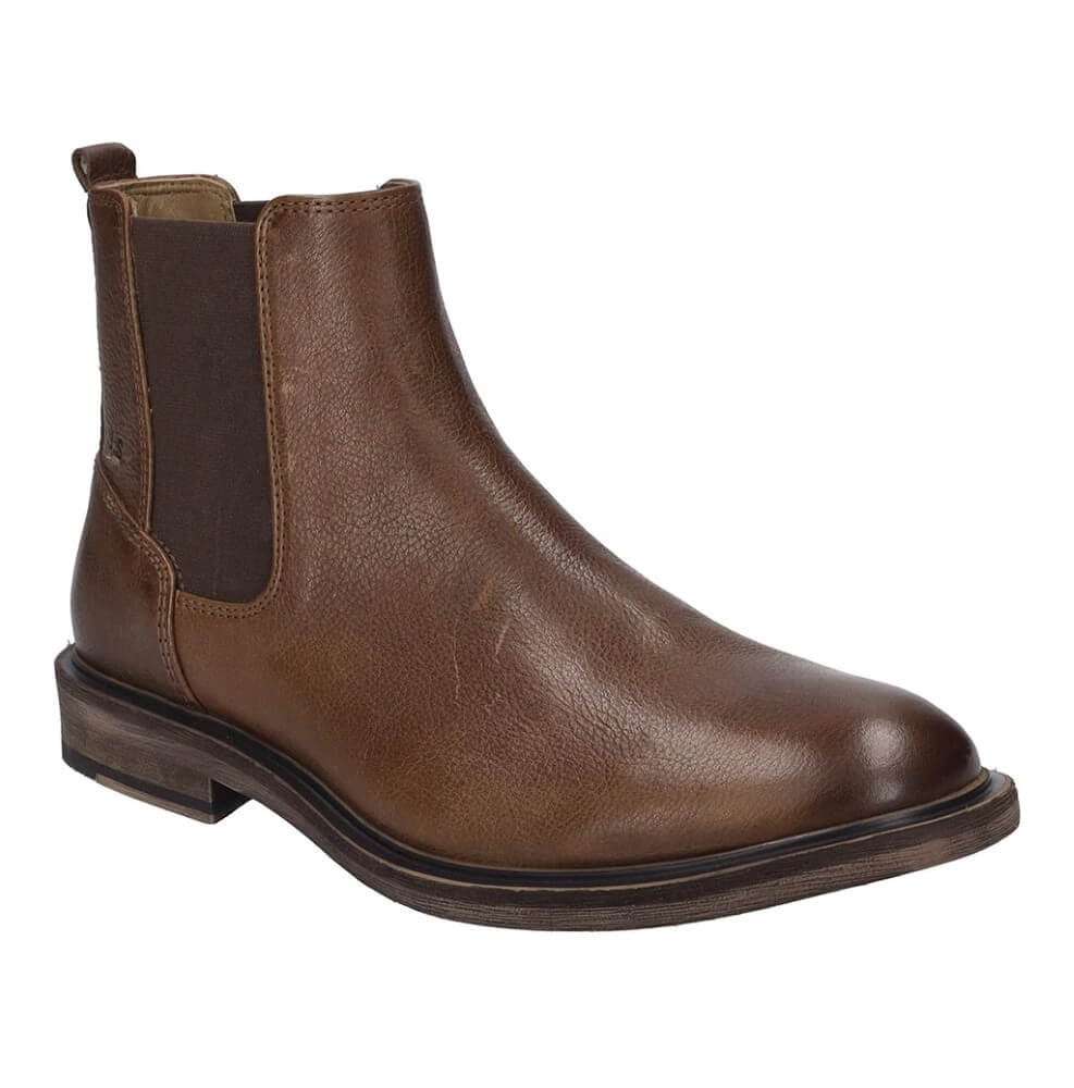 A Josef Seibel brown leather Chelsea boot with elastic side gore panels, shown in a side profile view against a plain white background.