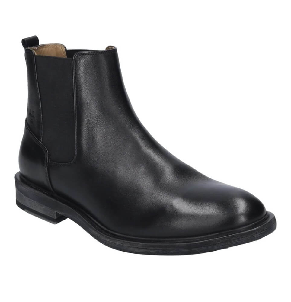 A black leather Chelsea ankle boot with elastic side gore panels, a low stacked heel, and a pull tab at the heel, shown from a three-quarters angle on a white background.