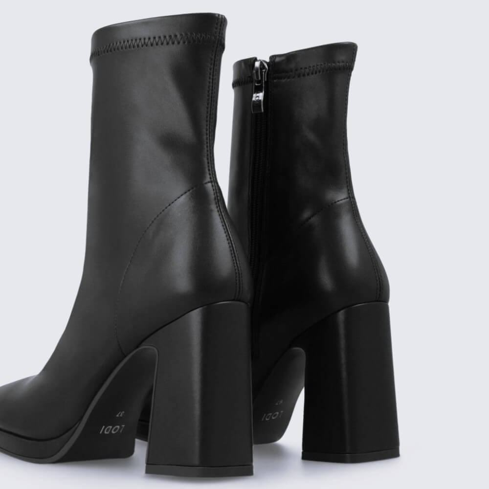 Black ankle boot with a block heel on a light gray background Lodi A-LAIRA Ankle Boots