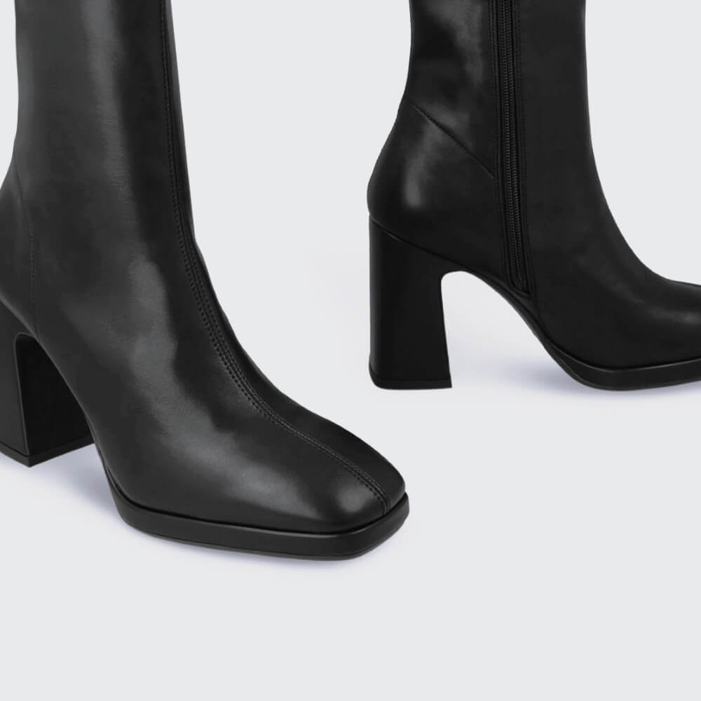 Black ankle boot with a block heel on a light gray background Lodi A-LAIRA Ankle Boots