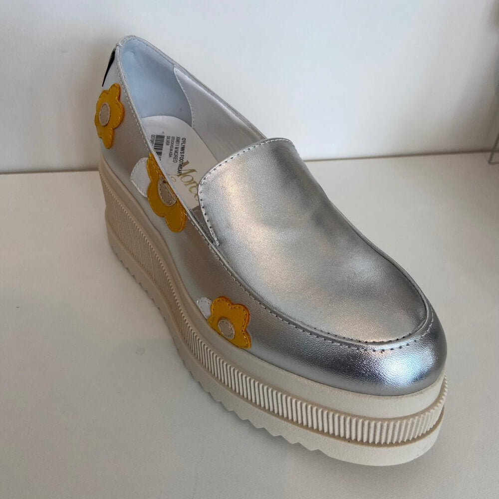Marco Moreo Silver platform shoe with yellow flower designs on a white background