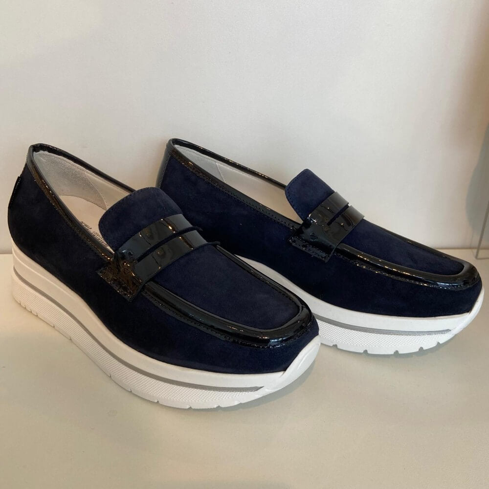 Marco Moreo Navy blue loafers with a white sole on a light grey background