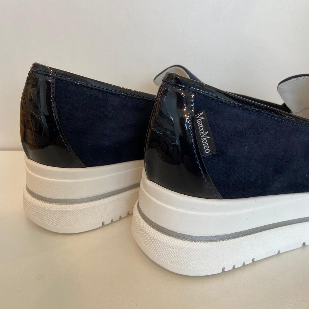 Marco Moreo Navy blue loafer with a white sole on a light grey background