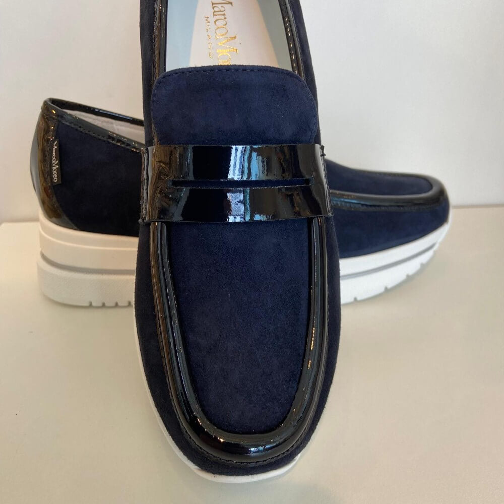 Marco Moreo Navy blue loafer with a white sole on a light grey background