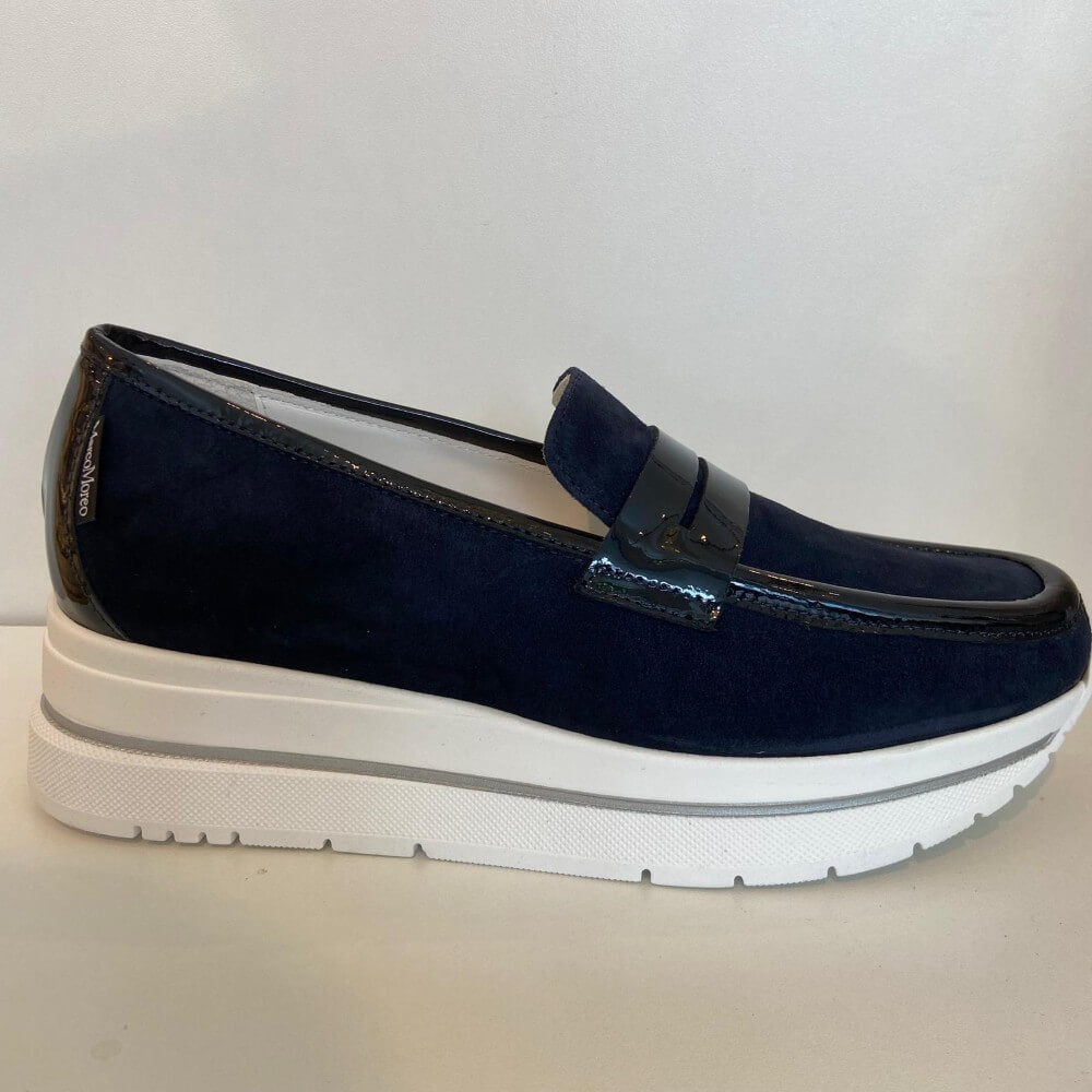 Marco Moreo Navy blue loafer with a white sole on a light grey background