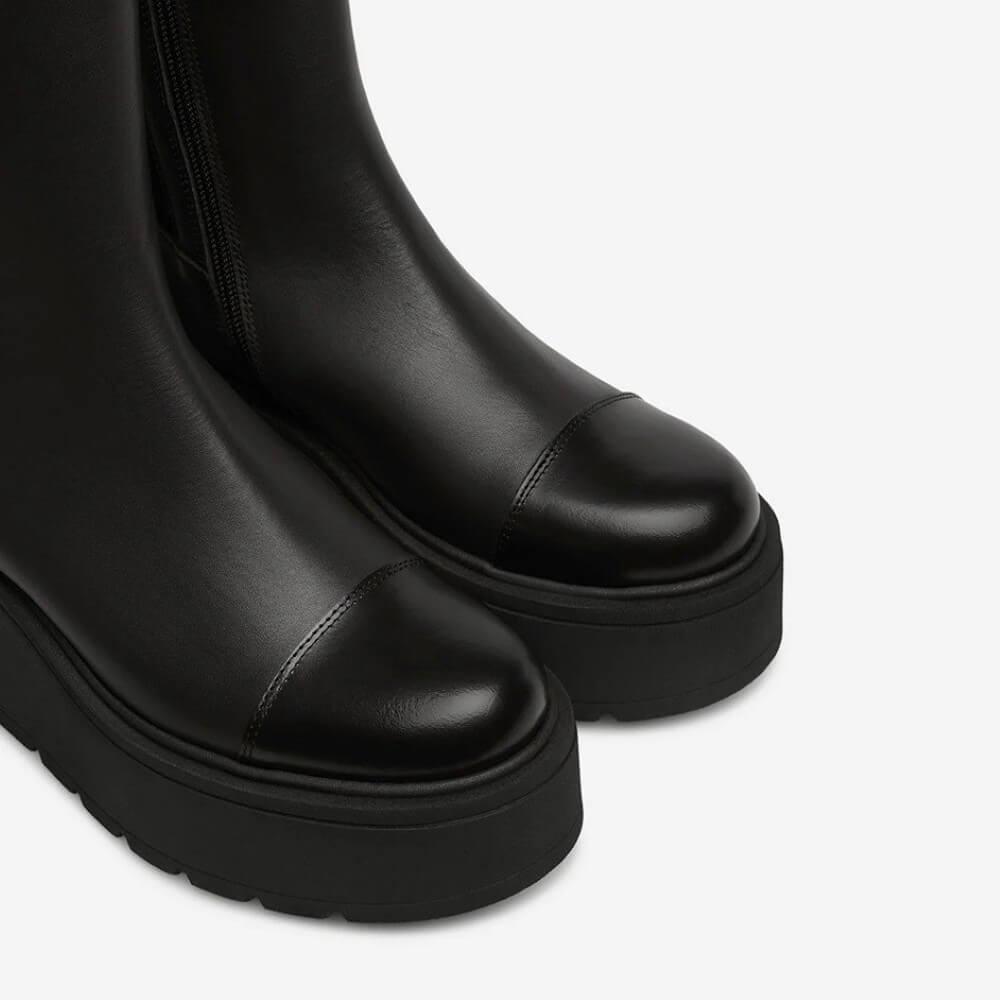 Pair of dark brown platform boots with ruffled details on a white background Brown Ankle Boot on a platform Sole Marco Moreo Vale Marlene AE4010