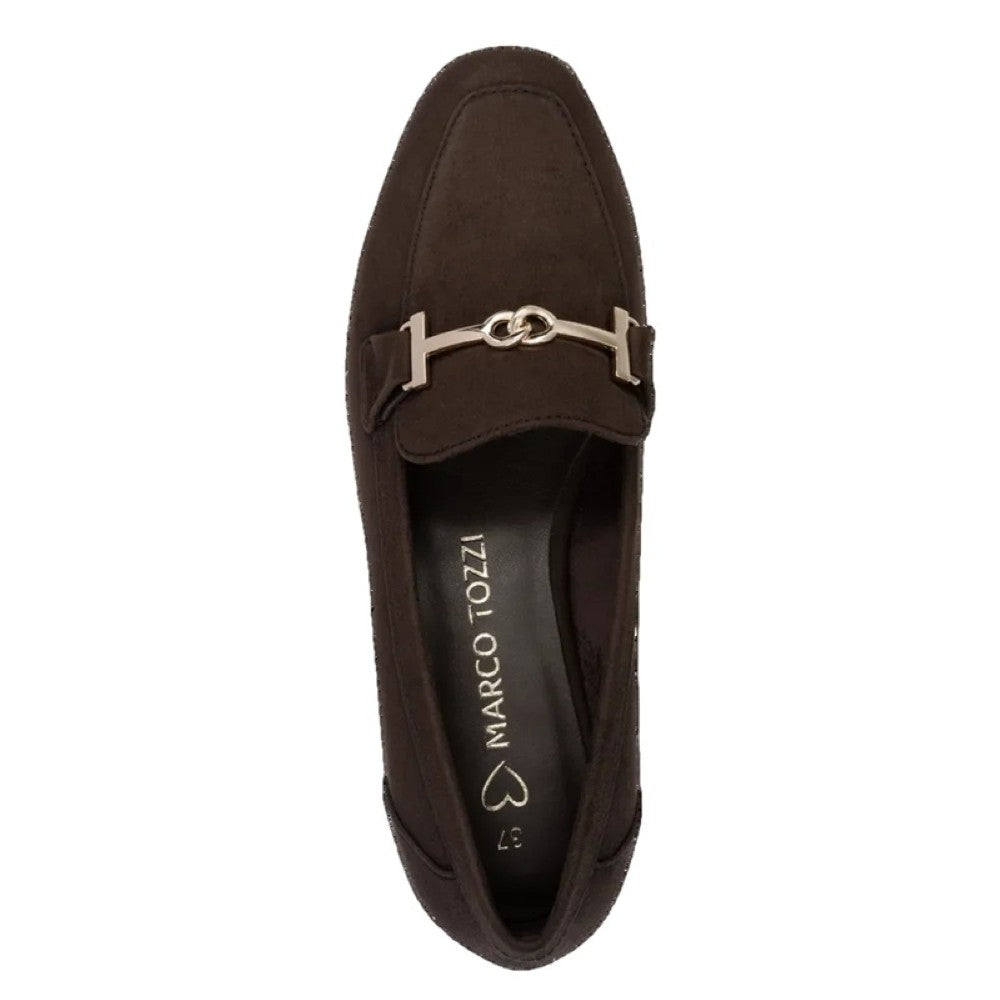 A dark brown suede loafer with a silver-tone horsebit detail across the vamp, shown from a top-down view on a white background. The insole displays the brand name 'MARCO TOZZI'.