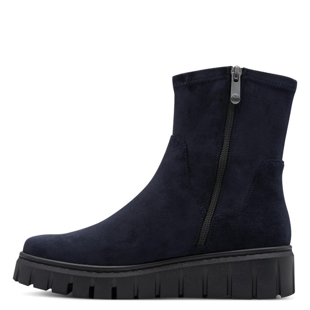 A Marco Tozzi dark navy blue suede ankle boot with a side zipper, a chunky black platform sole, and a ribbed lug outsole, shown from a side profile on a white background.