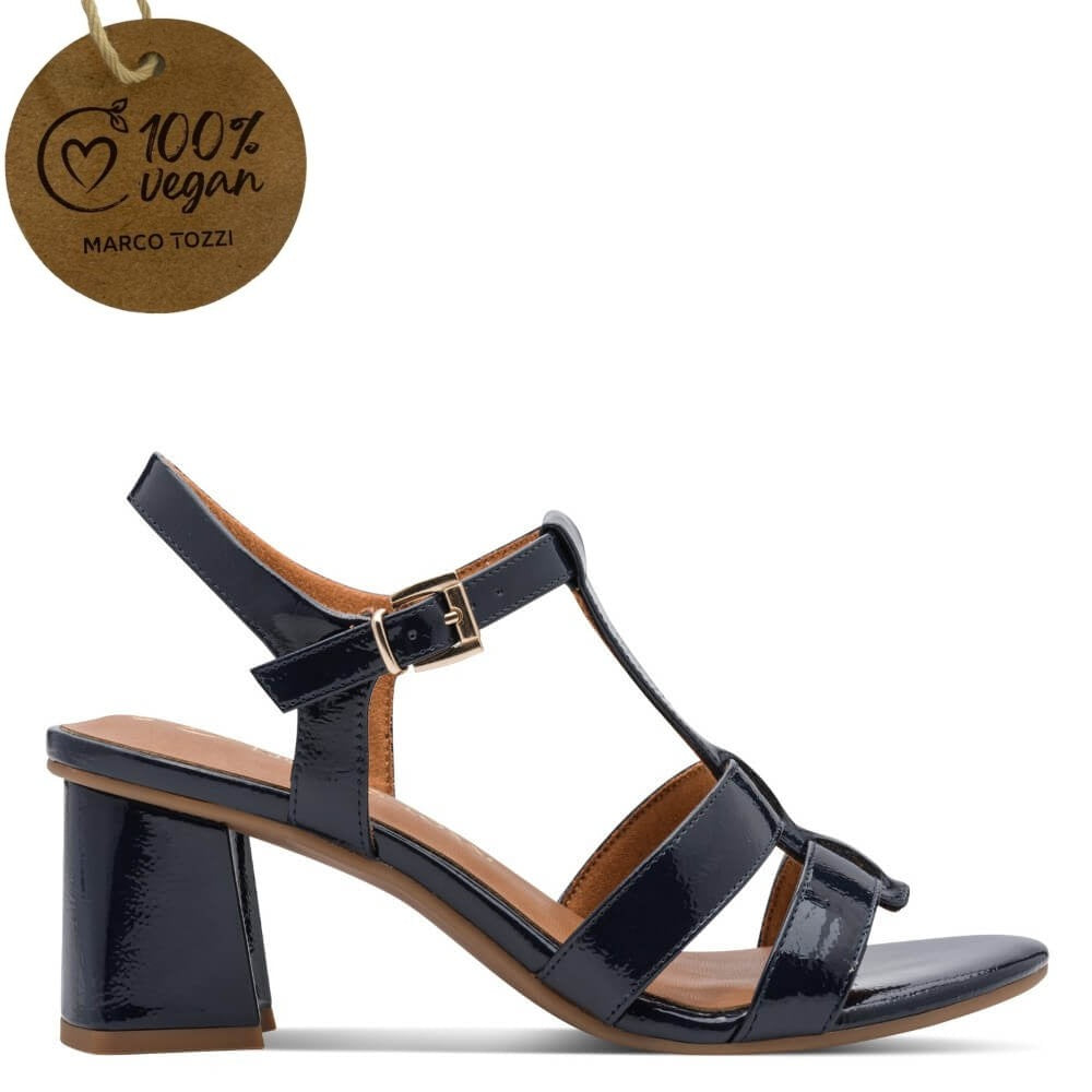 Marco Tozzi Navy patent leather sandal with a block heel and gold buckle, featuring a '100% vegan' tag.