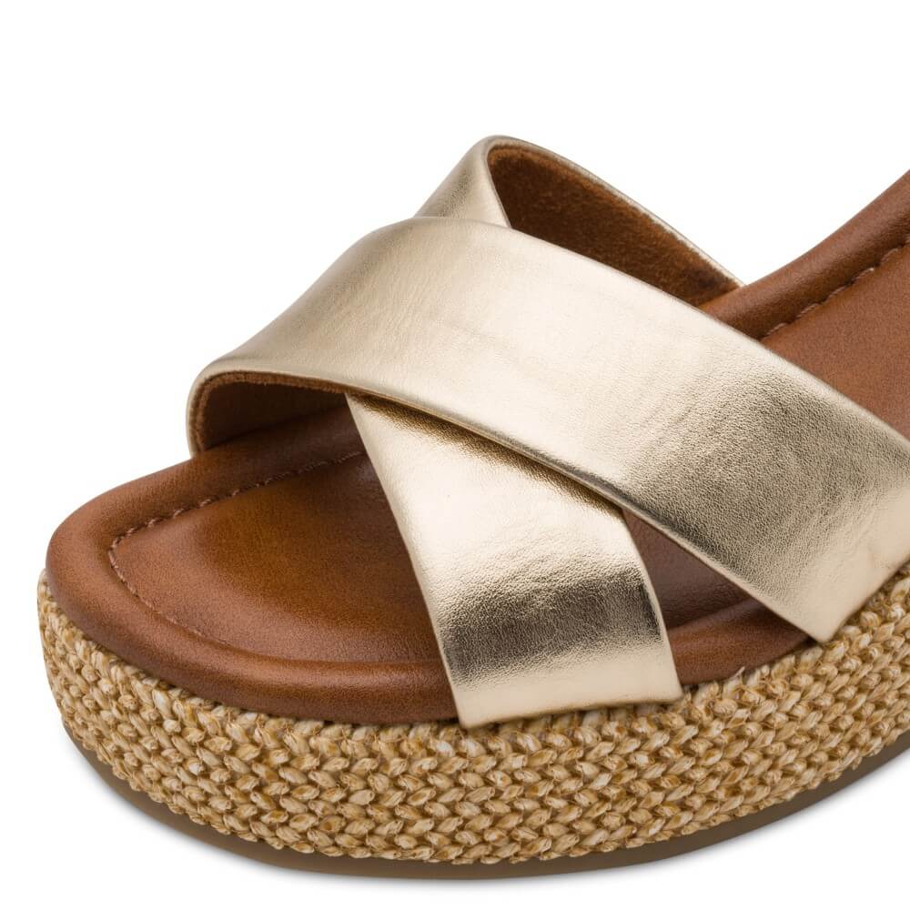Marco Tozzi Brown sandal with gold cross strap on a white background