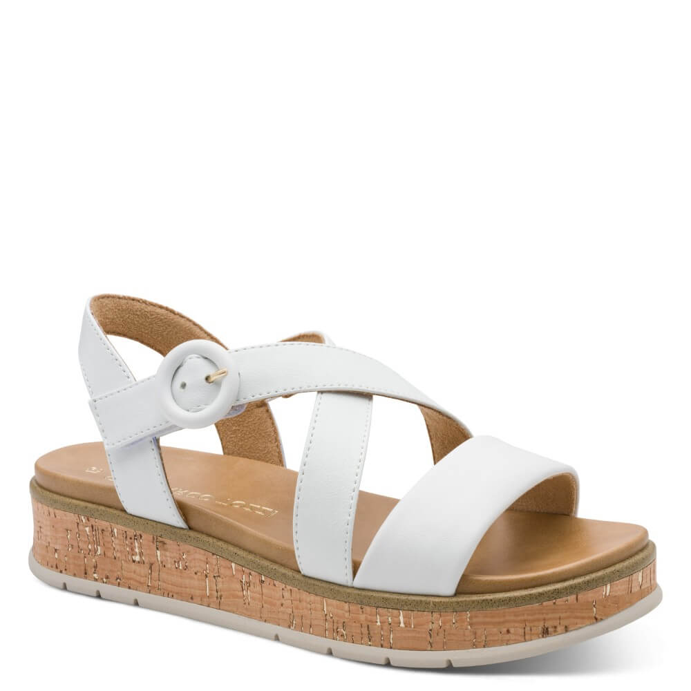 Marco Tozzi White sandal with cork platform and '100% vegan' tag on a white background