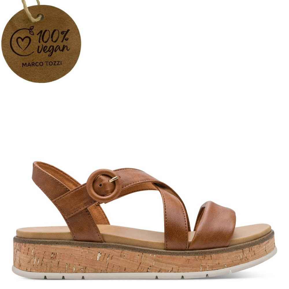 Marco Tozzi Brown sandal with cork platform and '100% vegan' tag on a white background